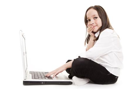 404 error image of a girl making an "oops" face at the camera while sitting at her laptop.